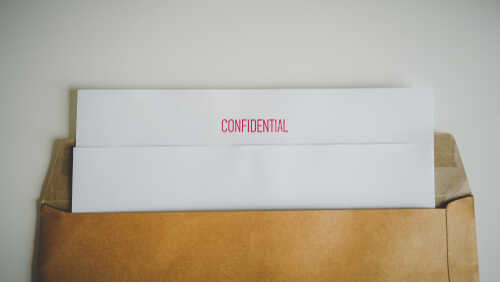 Close,Up,Confidential,Document,With,Brown,Bag.