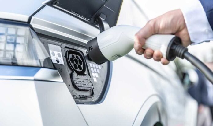 The,Driver,Of,The,Electric,Car,Inserts,The,Electrical,Connector