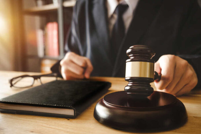 Justice,And,Law,Concept.male,Judge,In,A,Courtroom,With,The