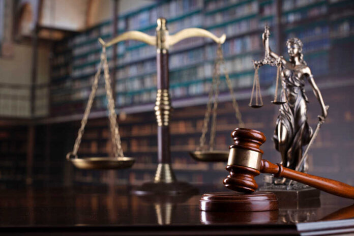 Judge's,Gavel,On,Library,Background.,Law,And,Justice,Concept.