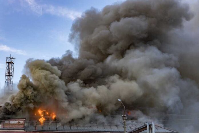 A,Large,Fire,Is,Burning,In,The,Sky,,With,Smoke
