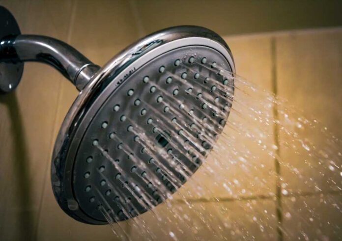 A,Showerhead,With,A,Water,Stream.,Resources,,Interiors,,Or,Environmental