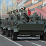 Moscow’s Secret Agenda: Peace Or Power Play? Military tanks in formation during a parade