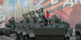 Military tanks in formation during a parade