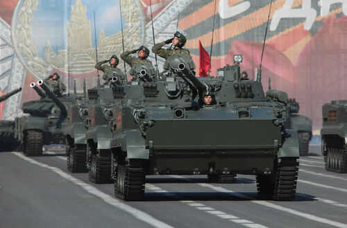 Military tanks in formation during a parade