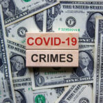 COVID-19 CRIMES on blocks, surrounded by dollar bills.