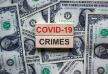 COVID-19 CRIMES on blocks, surrounded by dollar bills.