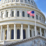 US Capitol dome with American flag flying