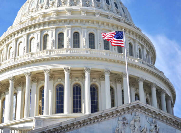 US Capitol dome with American flag flying