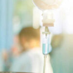 IV drip with blurred medical background