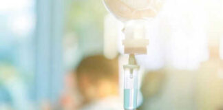 IV drip with blurred medical background