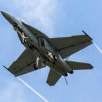 U.S. Military Boasts ZERO Casualties—Is It True? Military jet flying with vapor trails visible