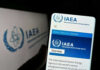IAEA website displayed on smartphone screen.