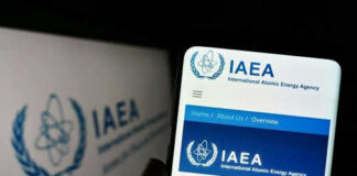 IAEA website displayed on smartphone screen.