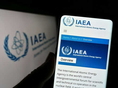 IAEA website displayed on smartphone screen.