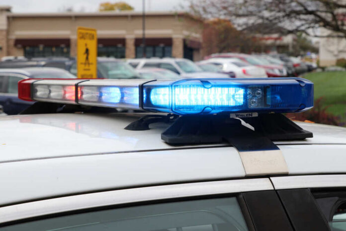 Close-up of a police car's emergency lights in a parking lot