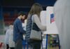 A person casting their vote at a polling station