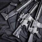 Virginia Gun Activists Fight Magazine BAN Black rifles on a dark fabric background