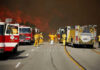 California Snowpack CRISIS – Fire Season Looms Firefighters battling large wildfire with fire trucks present