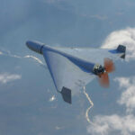 Drone flying over landscape with clouds and river