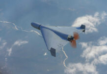 Drone flying over landscape with clouds and river