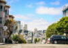 City street view with buildings and parked cars