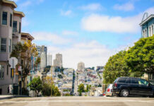 City street view with buildings and parked cars