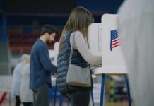 A person casting their vote at a polling station