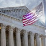 ICE Ruling Sparks Court Tensions, Sotomayor Apologizes The Supreme Court building with an American flag waving in front