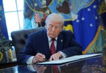 Legal Experts Warn of Potential War Crimes in Iran Donald Trump signing documents in the Oval Office