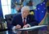 Iran’s Ceasefire Denial: Trump’s Claim in Crisis Donald Trump signing documents in the Oval Office