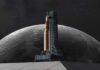 Artemis II Crew’s Lunar Flyby Stuns World A rocket on a launch pad with the moon in the background