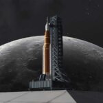 A rocket on a launch pad with the moon in the background