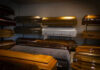 Coffins on display in a showroom.