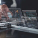 Hands typing on laptop with AI and code overlays