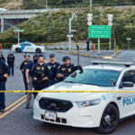Manifesto SHOCKER: San Diego Mosque Horror Police officers standing by patrol car and barricade tape