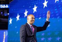 Child’s Question Puts Jeffries on the Hot Seat Man in suit waving against starry blue background
