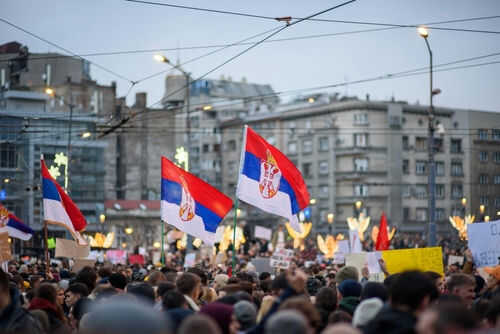 serbia-protest2561676275jpg Crowd holding Serbian flags during protest in city