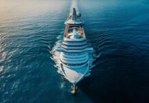 Aerial view of a large cruise ship sailing on calm ocean waters