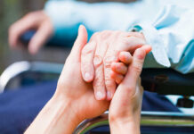 Michigan Democrats Push Death With Dignity Act Two hands clasped together, symbolizing care and support