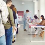 Voter-Approved Map AXED By Top Court People waiting in line at a polling station to cast their votes