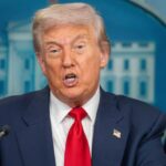 Gunman Breaches Security at Trump Dinner A political figure speaking at a press conference in front of the White House backdrop
