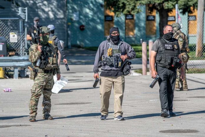 Law enforcement officers in tactical gear during an operation