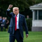 Unexpected Trump Move Jolts Texas Politics A political figure raising a fist while walking outdoors