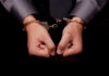 Armed Fugitive Feliciano Caught in Rhode Island Hands in handcuffs, symbolizing arrest or detention