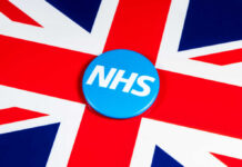 Lost Results: NHS Faces Life-or-Death Crisis Blue NHS badge on the Union Jack flag