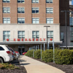Hospital emergency entrance with parked cars