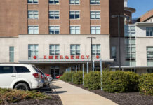 Hospital emergency entrance with parked cars