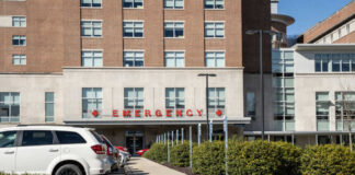 Hospital emergency entrance with parked cars