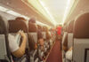Airline Etiquette MELTDOWN Spreads airplane cabin with passengers seated in rows